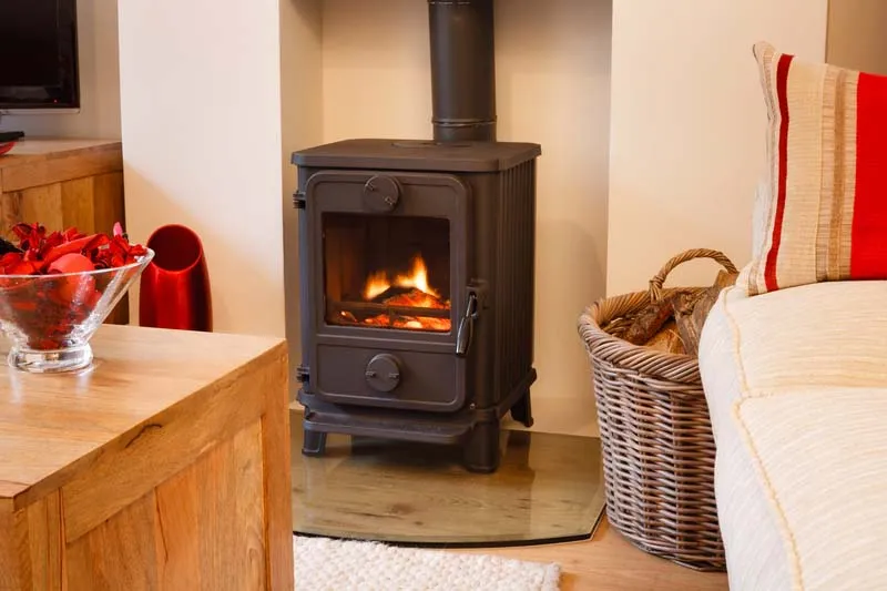 Wood burning stove. Cozy modern interior living room with wood burner